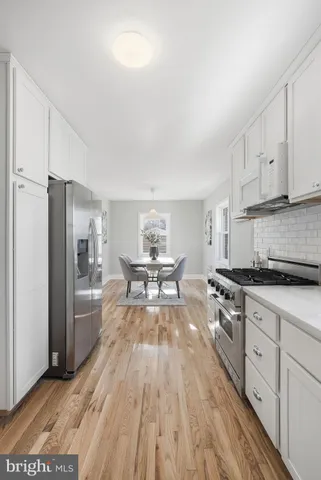 a bedroom with furniture and a wooden floor