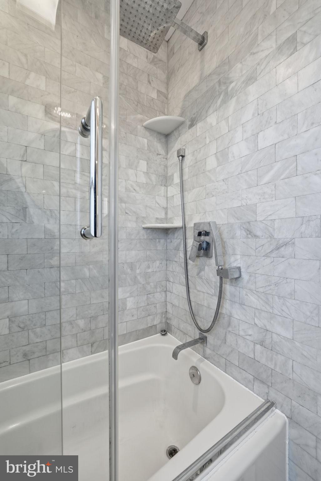 8712 Geren Road Silver Spring, MD 20901 - Photo 33 of 72 a bathroom with a tub and a shower