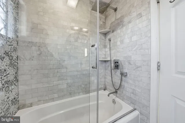 a view of wooden floor and windows in a room