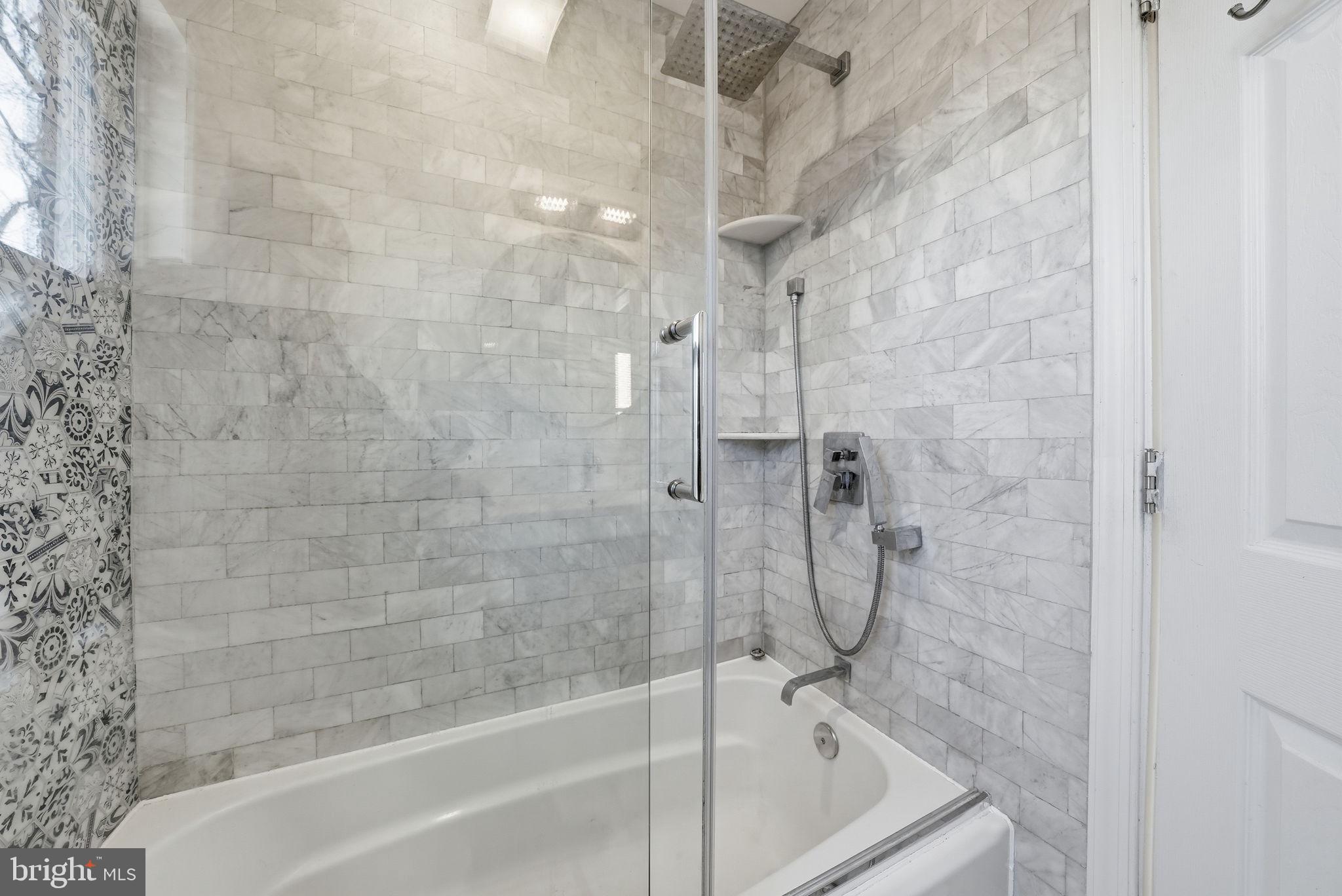 8712 Geren Road Silver Spring, MD 20901 - Photo 34 of 72 a bathroom with a shower and a bathtub