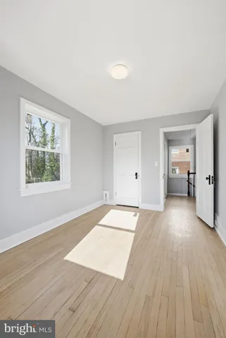 a view of a hallway with washer and dryer