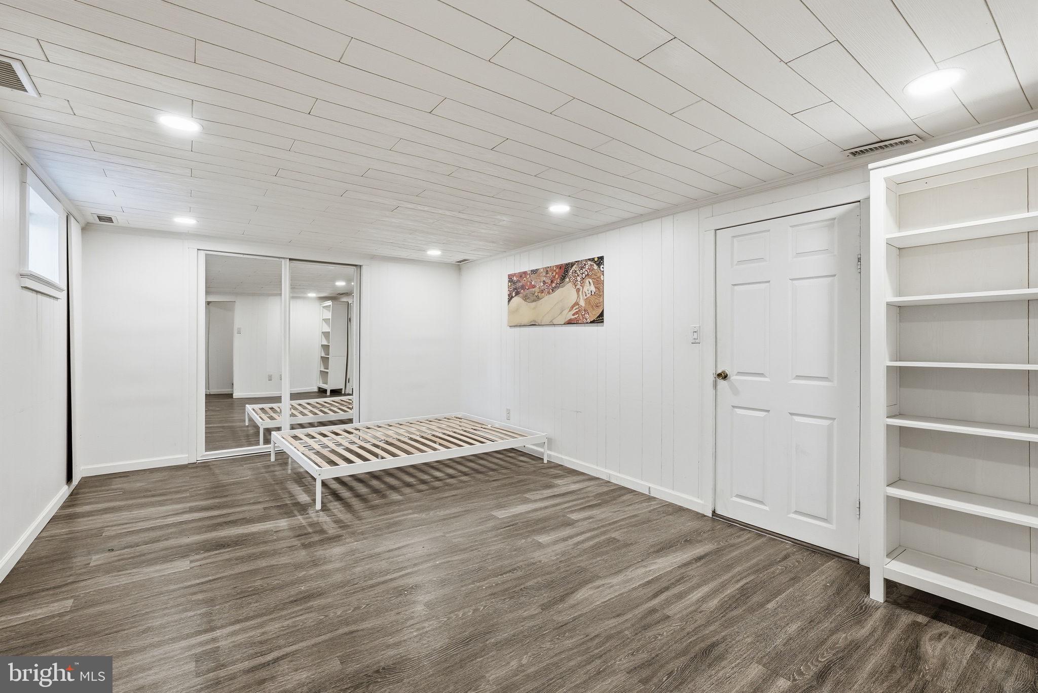 8712 Geren Road Silver Spring, MD 20901 - Photo 49 of 72 a view of wooden floor and windows in a room
