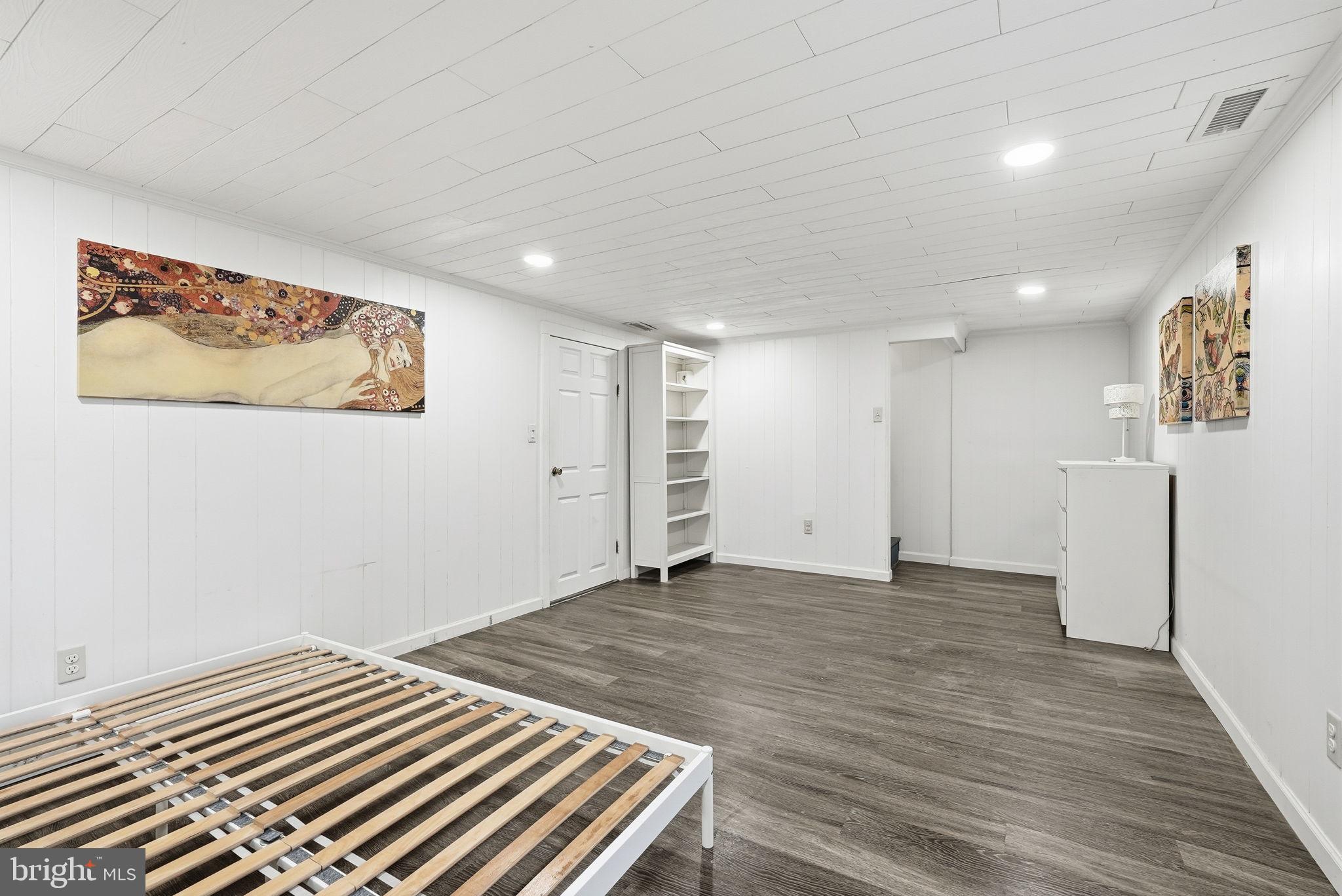 8712 Geren Road Silver Spring, MD 20901 - Photo 54 of 72 a view of a bedroom with wooden floor and closet