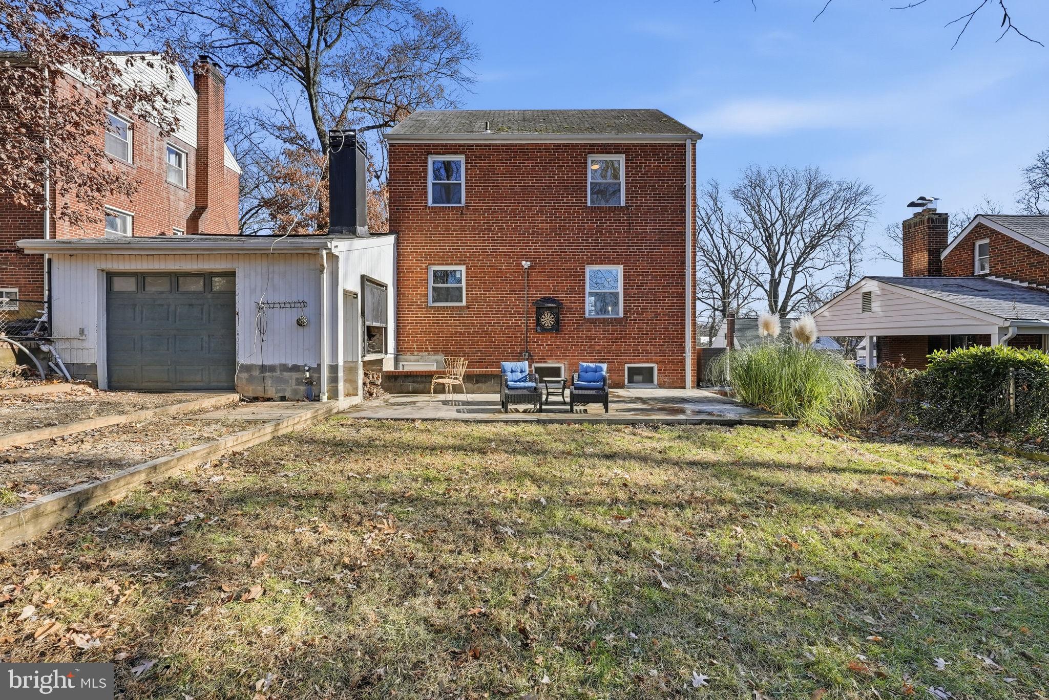 8712 Geren Road Silver Spring, MD 20901 - Photo 66 of 72 a backyard of a house with yard and outdoor seating
