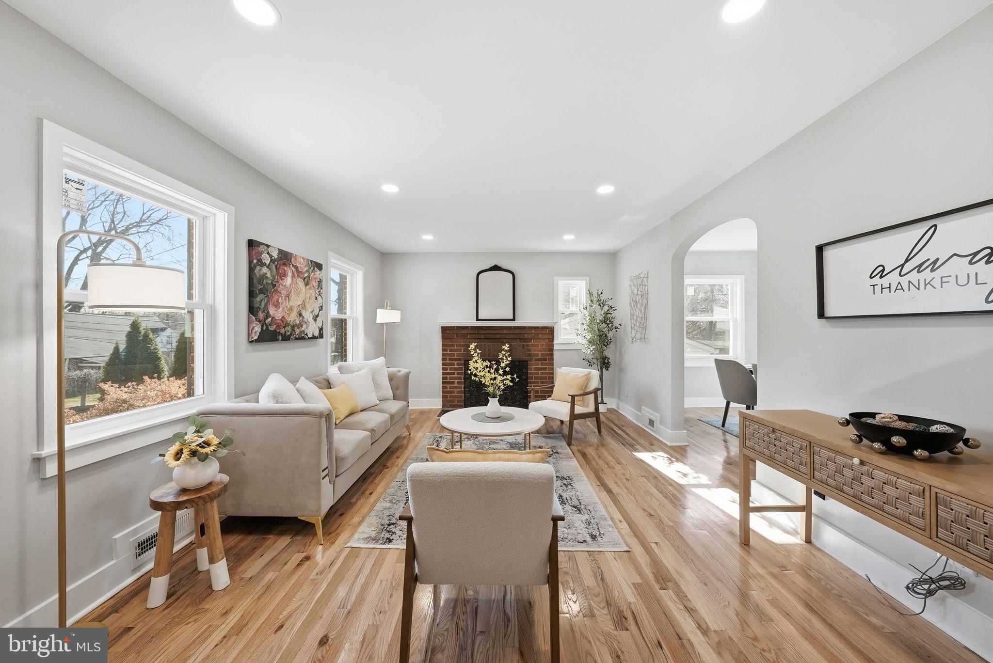8712 Geren Road Silver Spring, MD 20901 - Photo 7 of 72 a living room with furniture and a fireplace