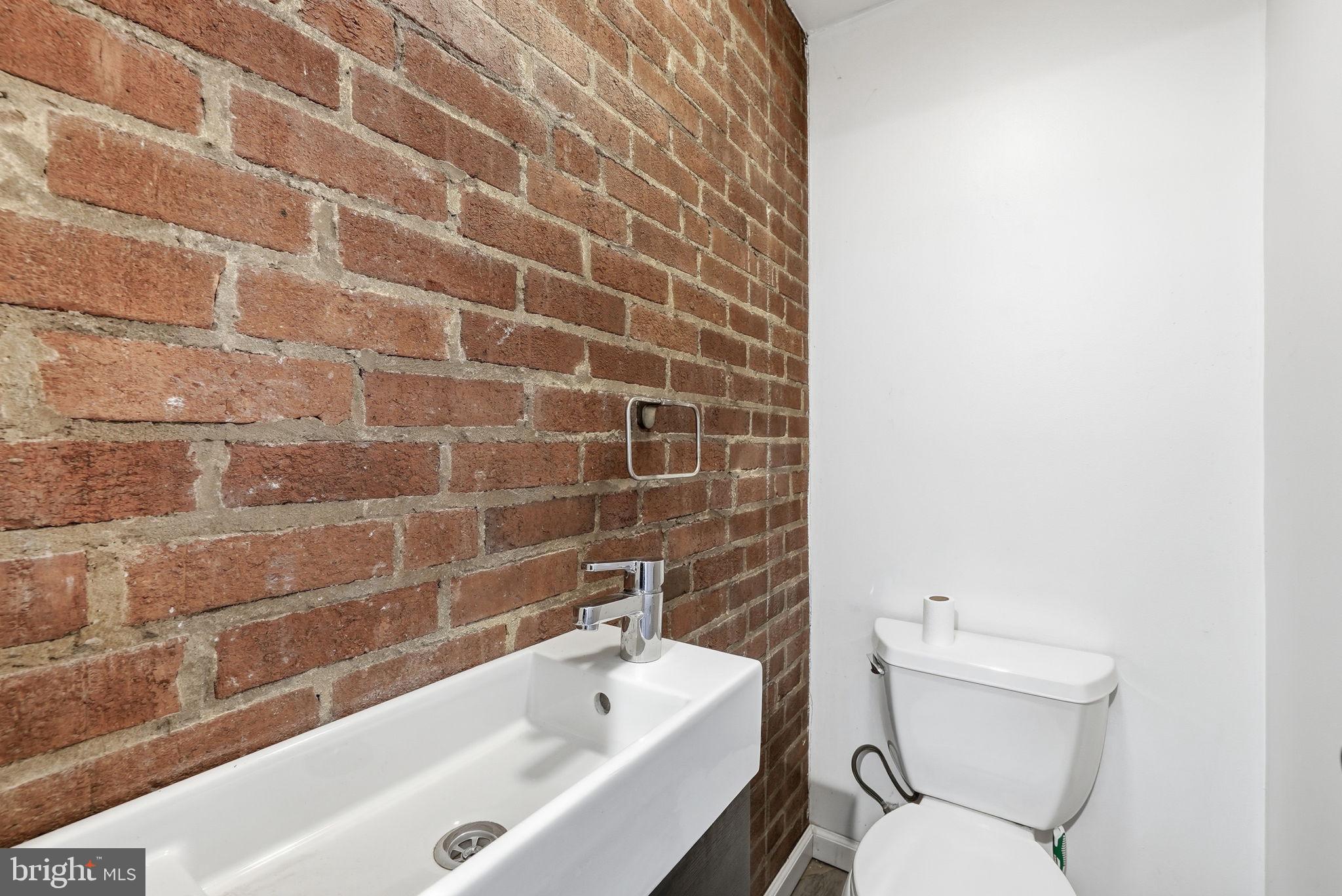 8712 Geren Road Silver Spring, MD 20901 - Photo 71 of 72 a bathroom with a toilet a sink and bathtub