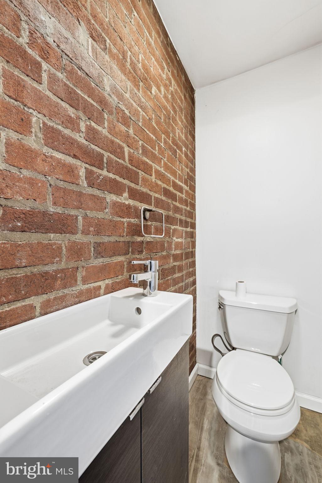 8712 Geren Road Silver Spring, MD 20901 - Photo 72 of 72 a bathroom with a sink a toilet and bathtub
