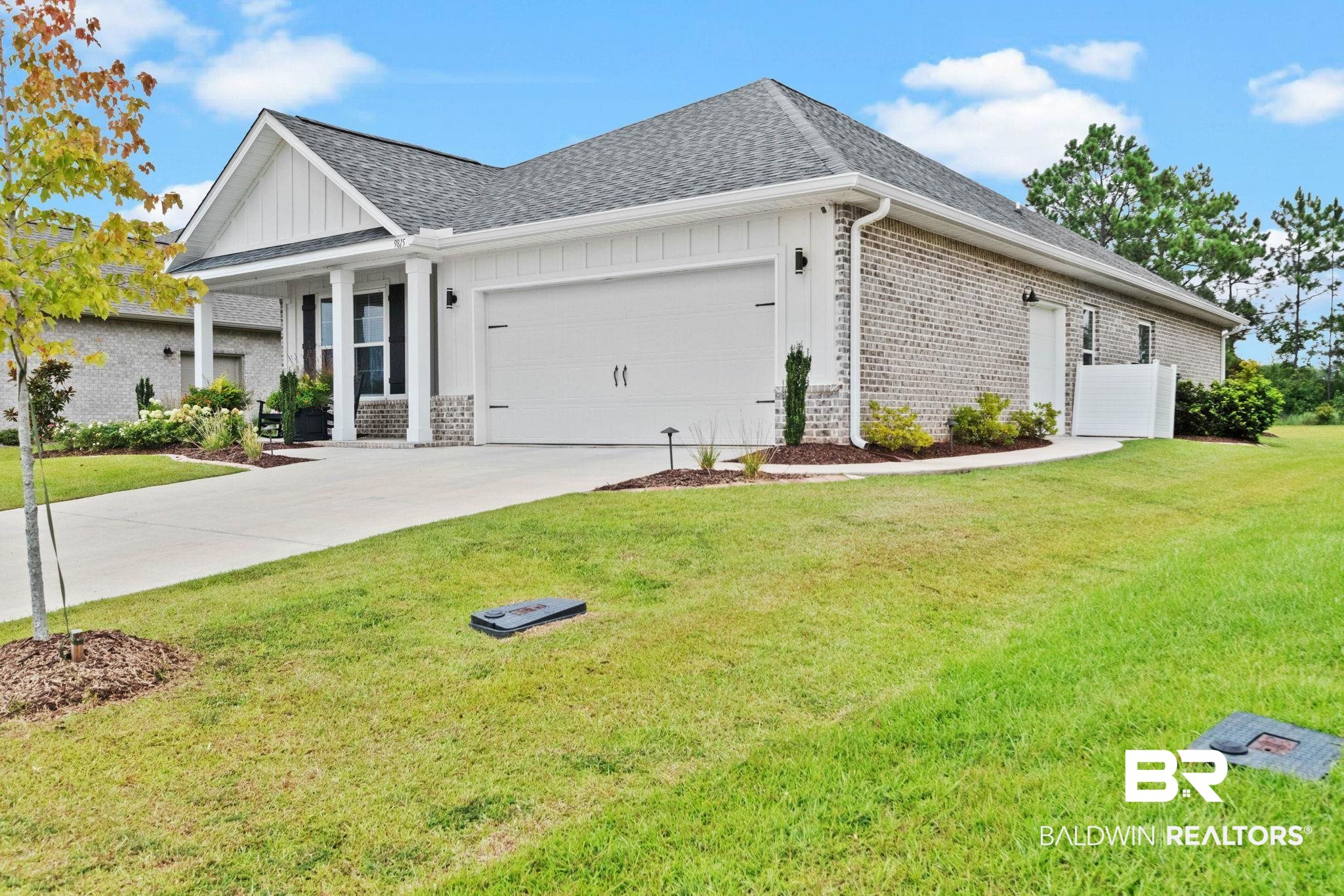 9815 Lakeview Drive Foley, AL 36535 - Photo 7 of 100 View of front of property featuring a garage and a front yard