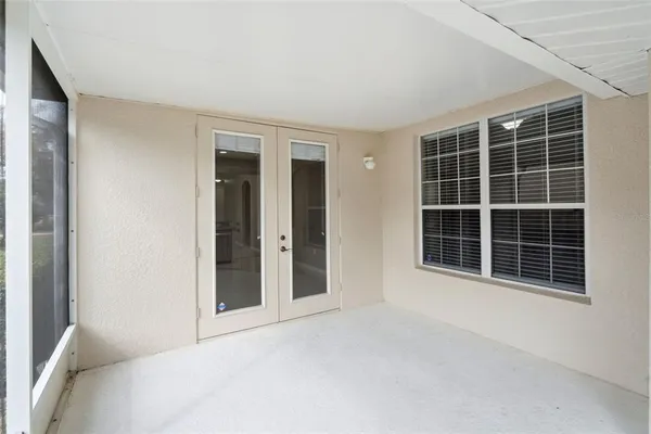 a view of empty room with windows