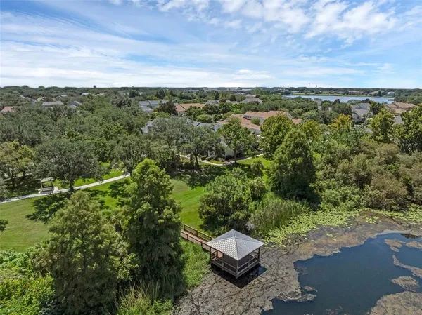 an aerial view of a house with a yard