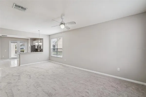 a view of an empty room with a window