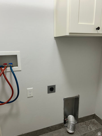 175 North 100th West Centerfield, UT 84622 - Photo 15 of 32 Laundry area with white shaker-style cabinetry, dark cabinet hardware, utility connections, and tile flooring