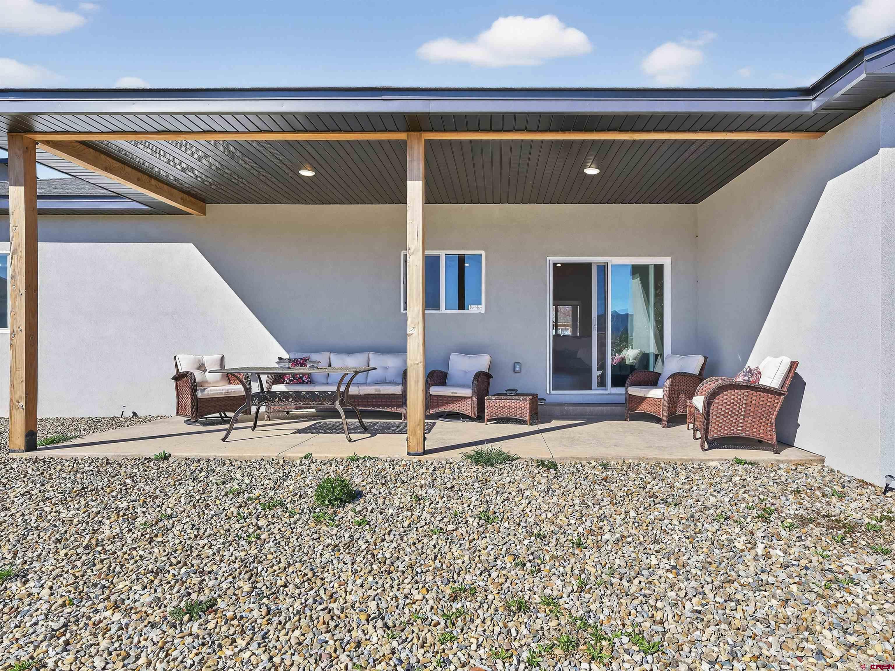 1615 Rivera Street Cortez, CO 81321 - Photo 20 of 21 a living room with furniture and a rug