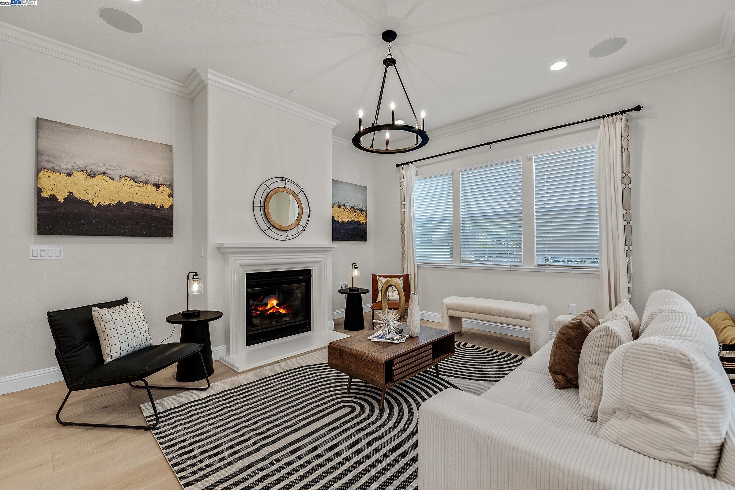 4519 Spring Mountain Way Dublin, CA 94568 - Photo 16 of 52 a living room with furniture a fireplace and a flat screen tv