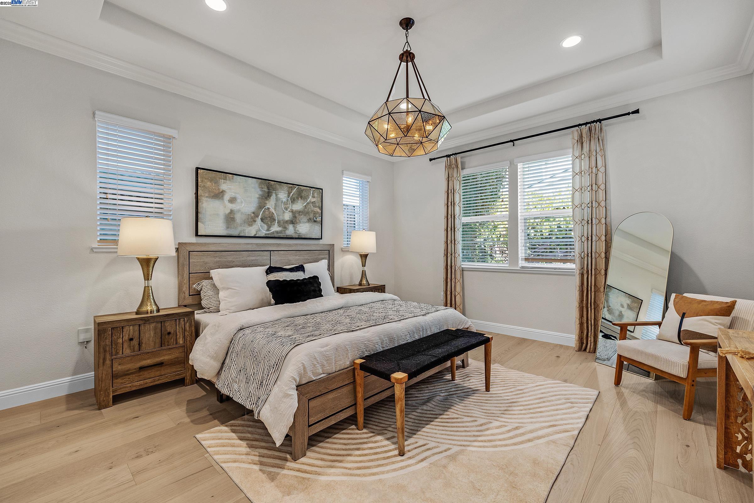 4519 Spring Mountain Way Dublin, CA 94568 - Photo 18 of 52 a bedroom with a bed and a table