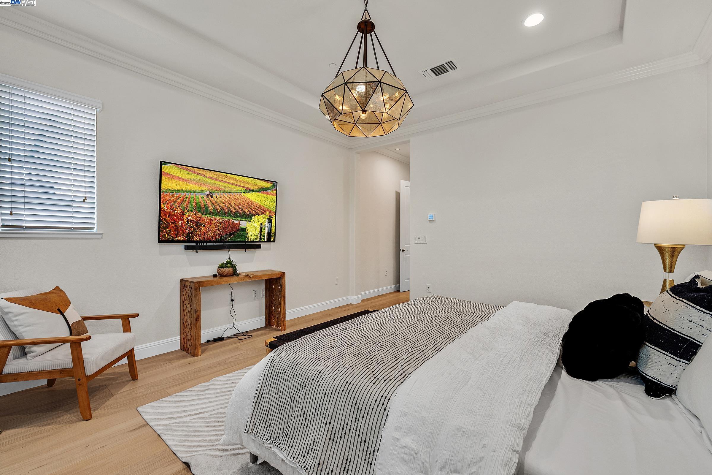 4519 Spring Mountain Way Dublin, CA 94568 - Photo 19 of 52 a bedroom with a bed and a flat screen tv