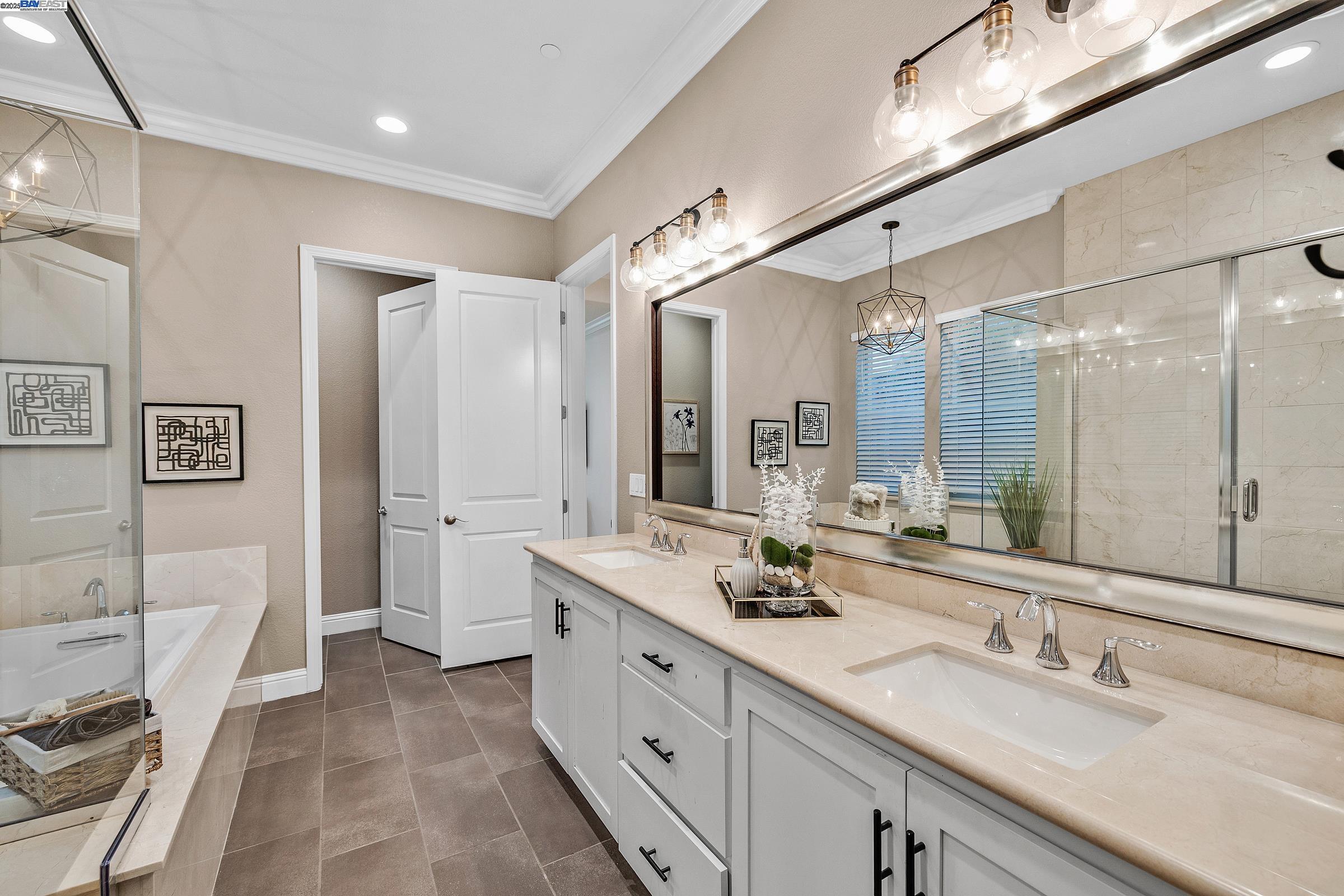4519 Spring Mountain Way Dublin, CA 94568 - Photo 20 of 52 a spacious bathroom with a double vanity sink mirror double and bathtub