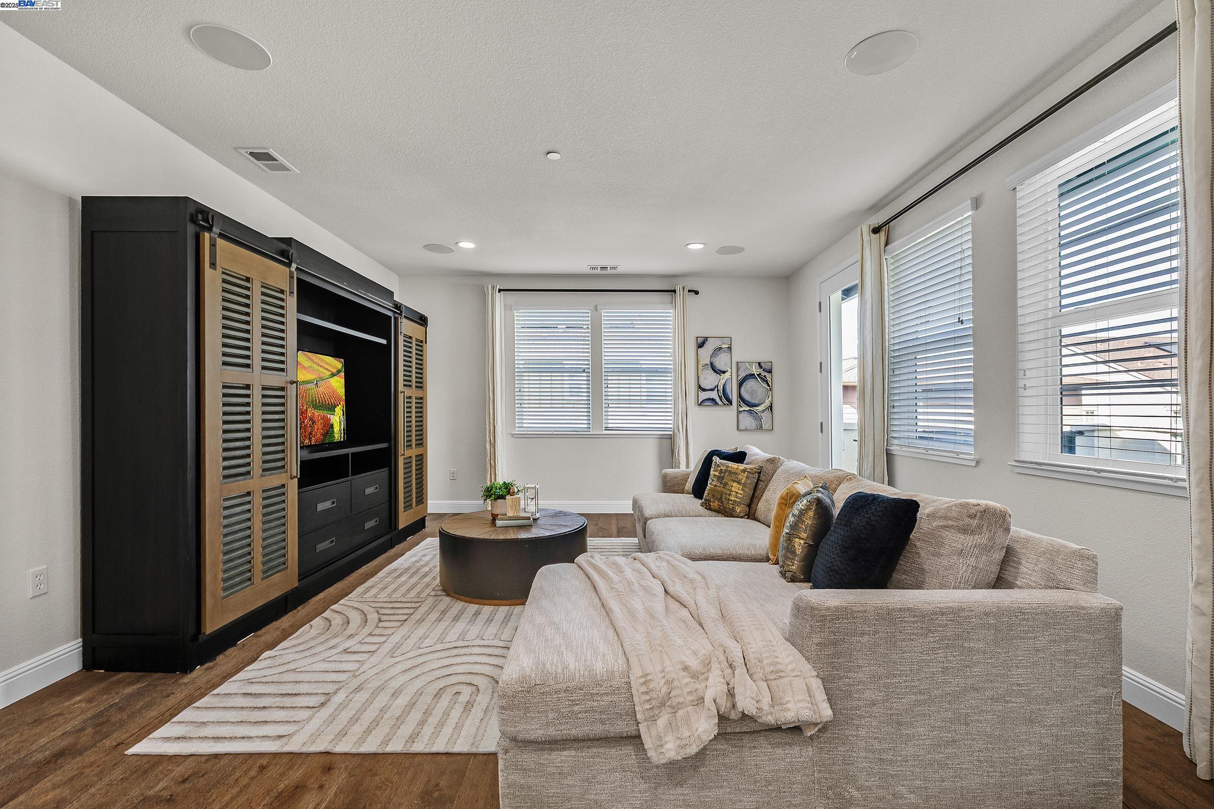 4519 Spring Mountain Way Dublin, CA 94568 - Photo 24 of 52 a living room with furniture and a flat screen tv