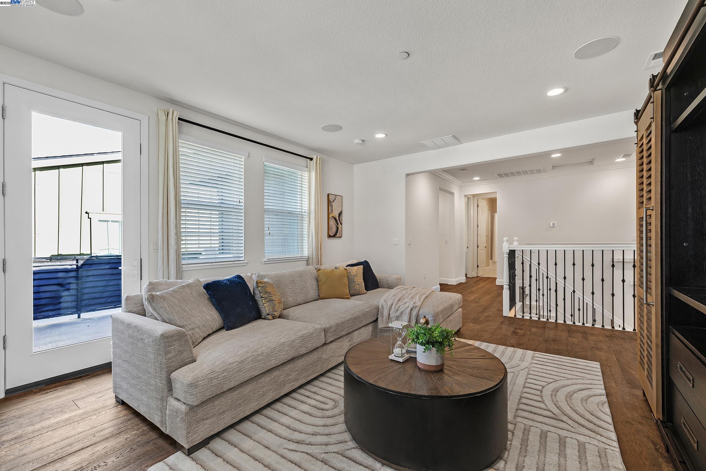 4519 Spring Mountain Way Dublin, CA 94568 - Photo 25 of 52 a living room with furniture and a potted plant