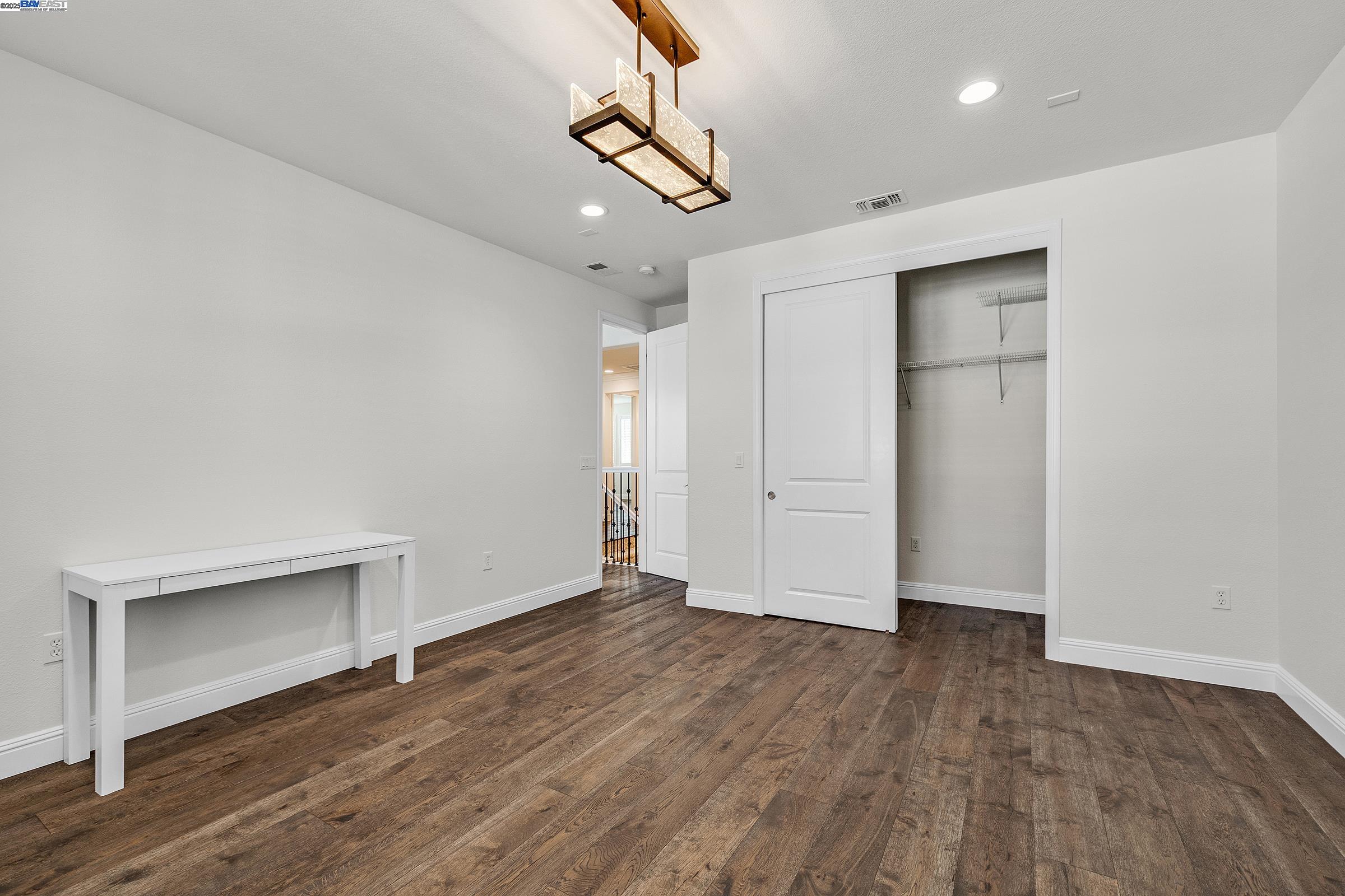4519 Spring Mountain Way Dublin, CA 94568 - Photo 27 of 52 a view of empty room with wooden floor