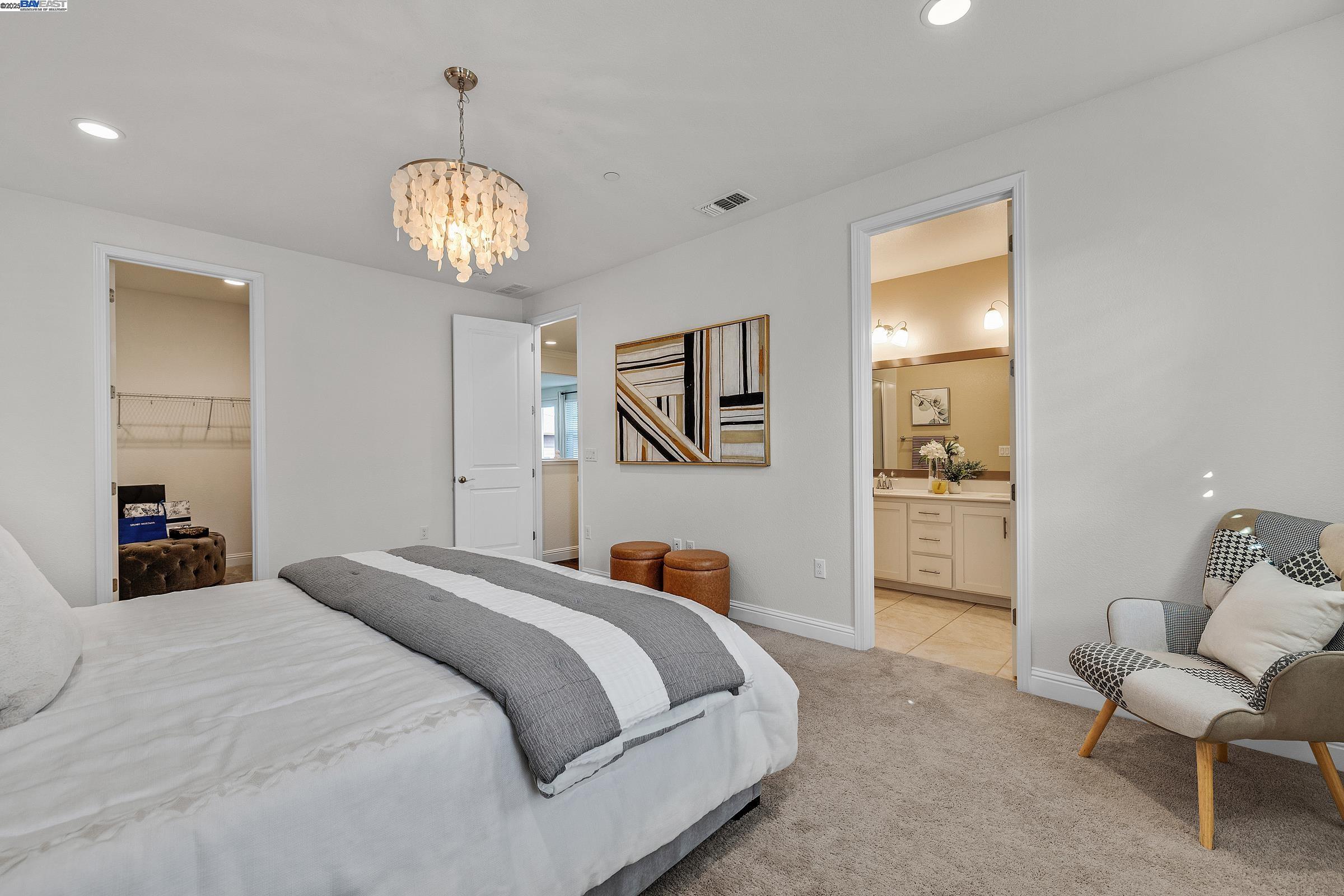 4519 Spring Mountain Way Dublin, CA 94568 - Photo 32 of 52 a bedroom with bed and furniture