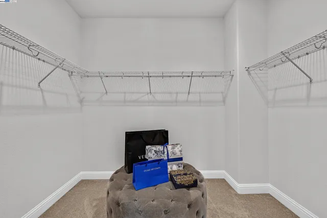 a view of a patio with table and chairs with wooden floor and fence