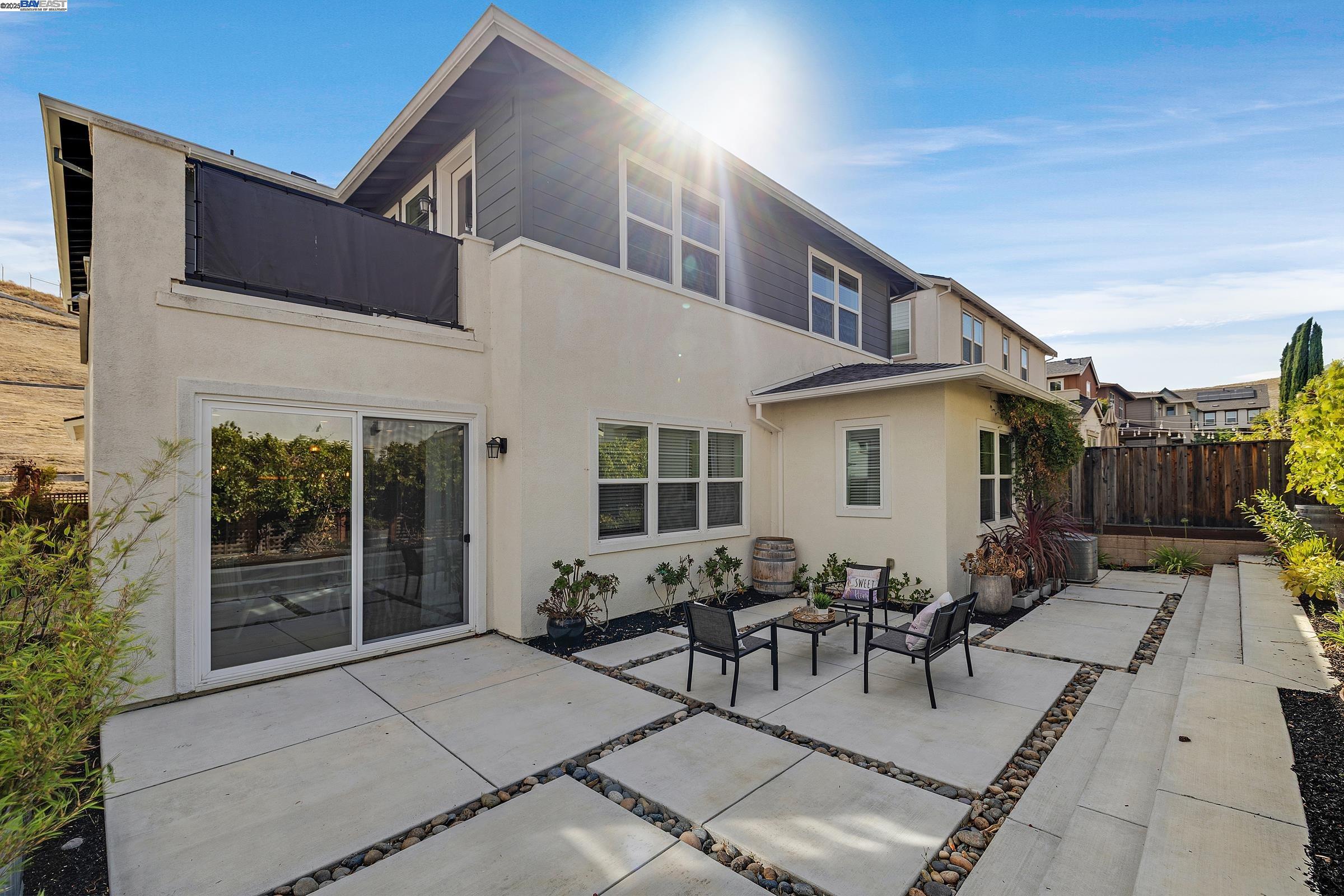 4519 Spring Mountain Way Dublin, CA 94568 - Photo 36 of 52 a view of a patio with table and chairs with wooden floor and fence