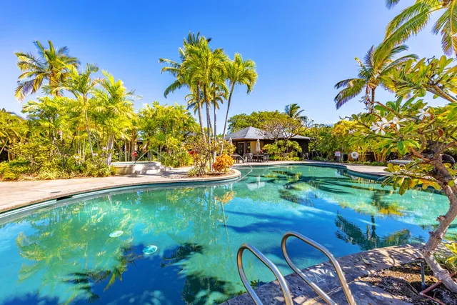 a view of a swimming pool with a lounge chairs