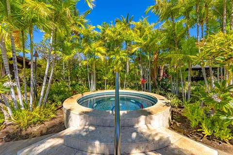 a view of swimming pool with a table and chairs