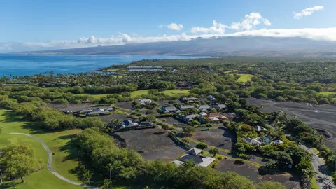 a view of a yard with an ocean