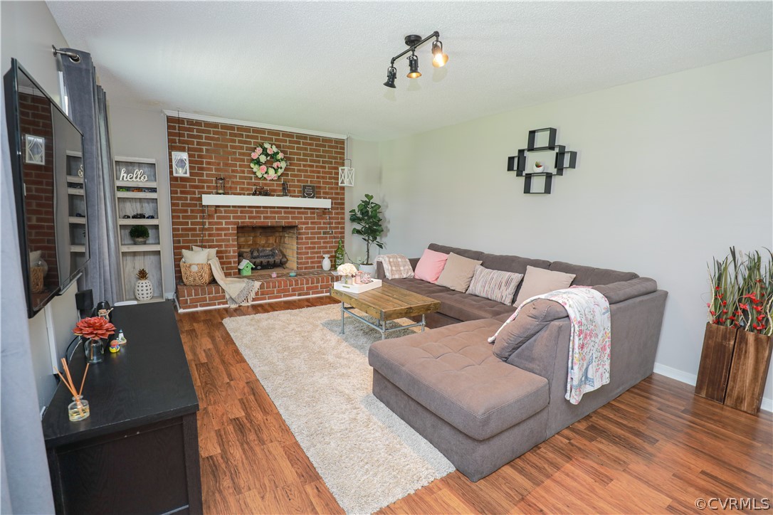 3012 Fielding Road Colonial Heights, VA 23834 - Photo 3 of 15 a living room with furniture fireplace and wooden floor