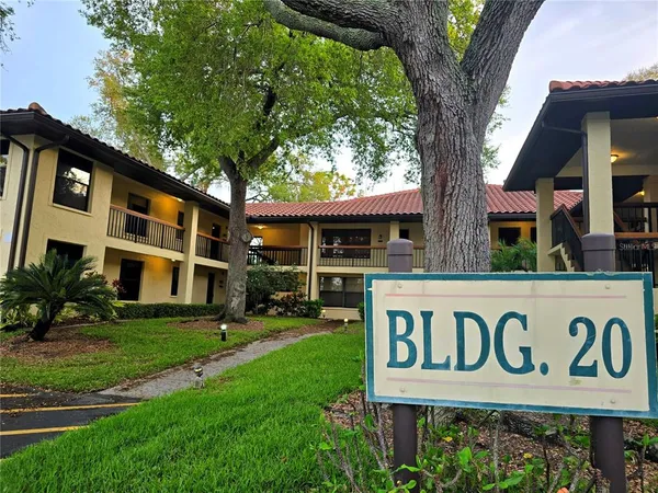 a view of a sign board with a yard