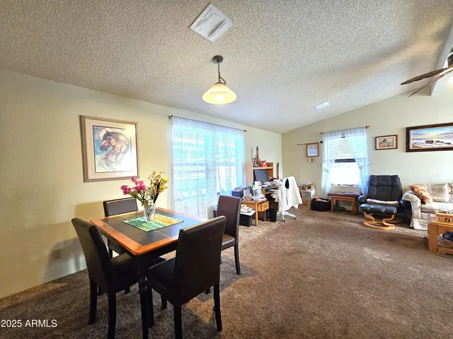 a view of a dining room with furniture