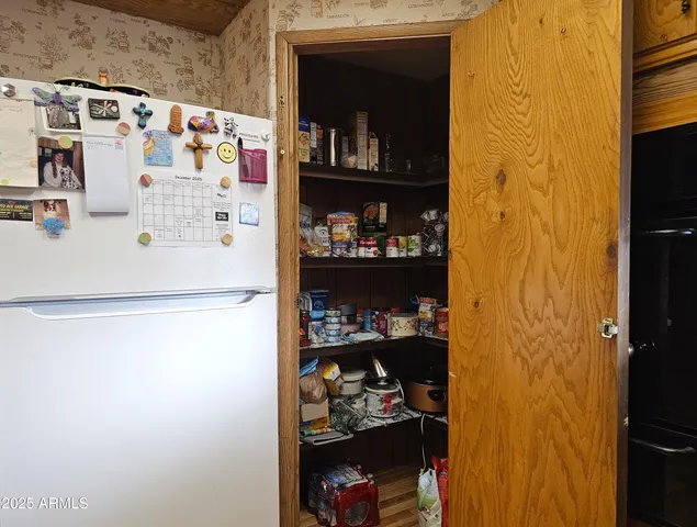 a white refrigerator freezer sitting inside of a kitchen
