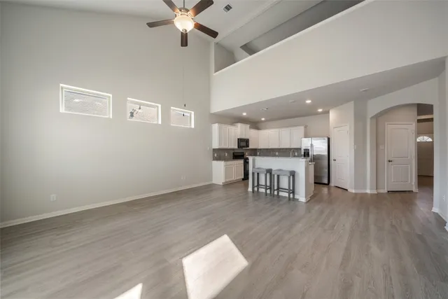 a dining room with furniture and wooden floor