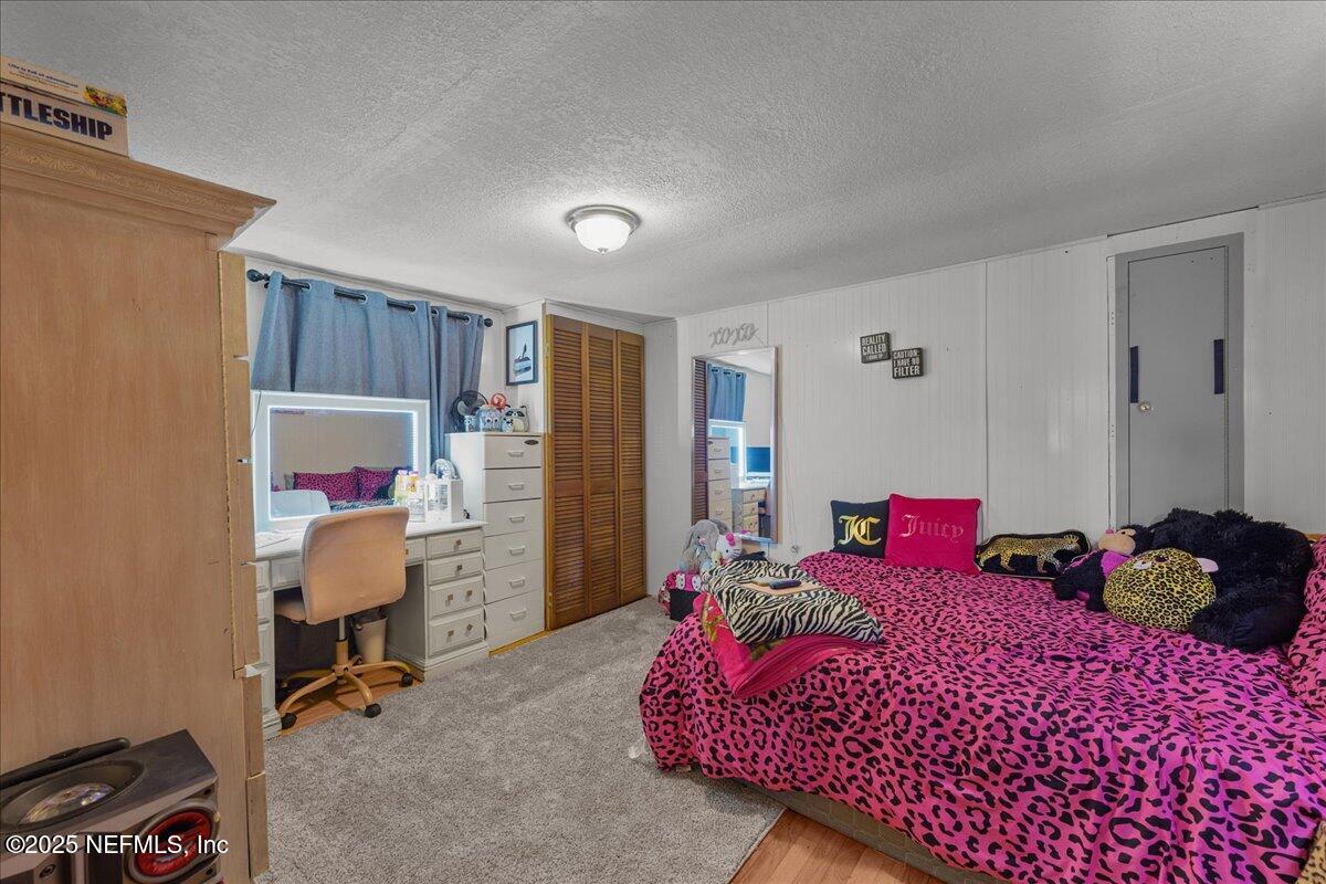 4961 Bent Twig Road Middleburg, FL 32068 - Photo 11 of 17 a bedroom with a bed and a window