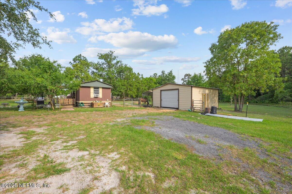 4961 Bent Twig Road Middleburg, FL 32068 - Photo 14 of 17 a front view of a house with garden