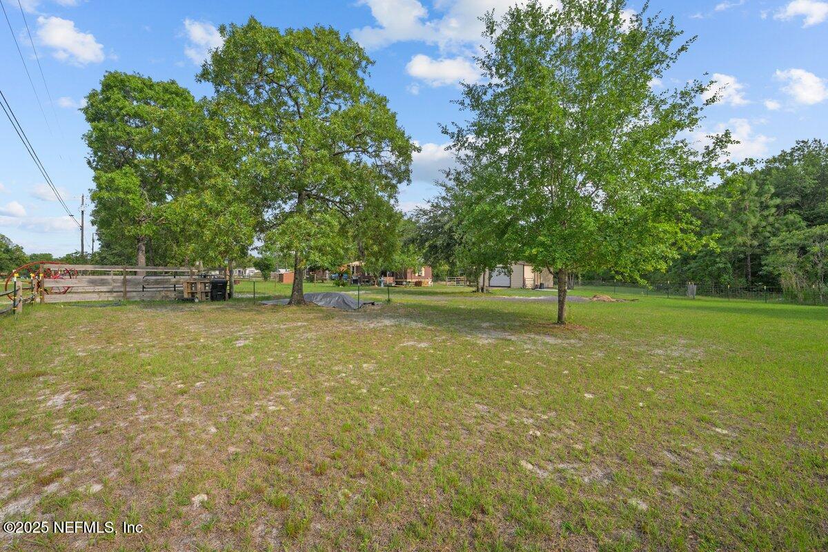 4961 Bent Twig Road Middleburg, FL 32068 - Photo 15 of 17 a view of outdoor space with deck and yard