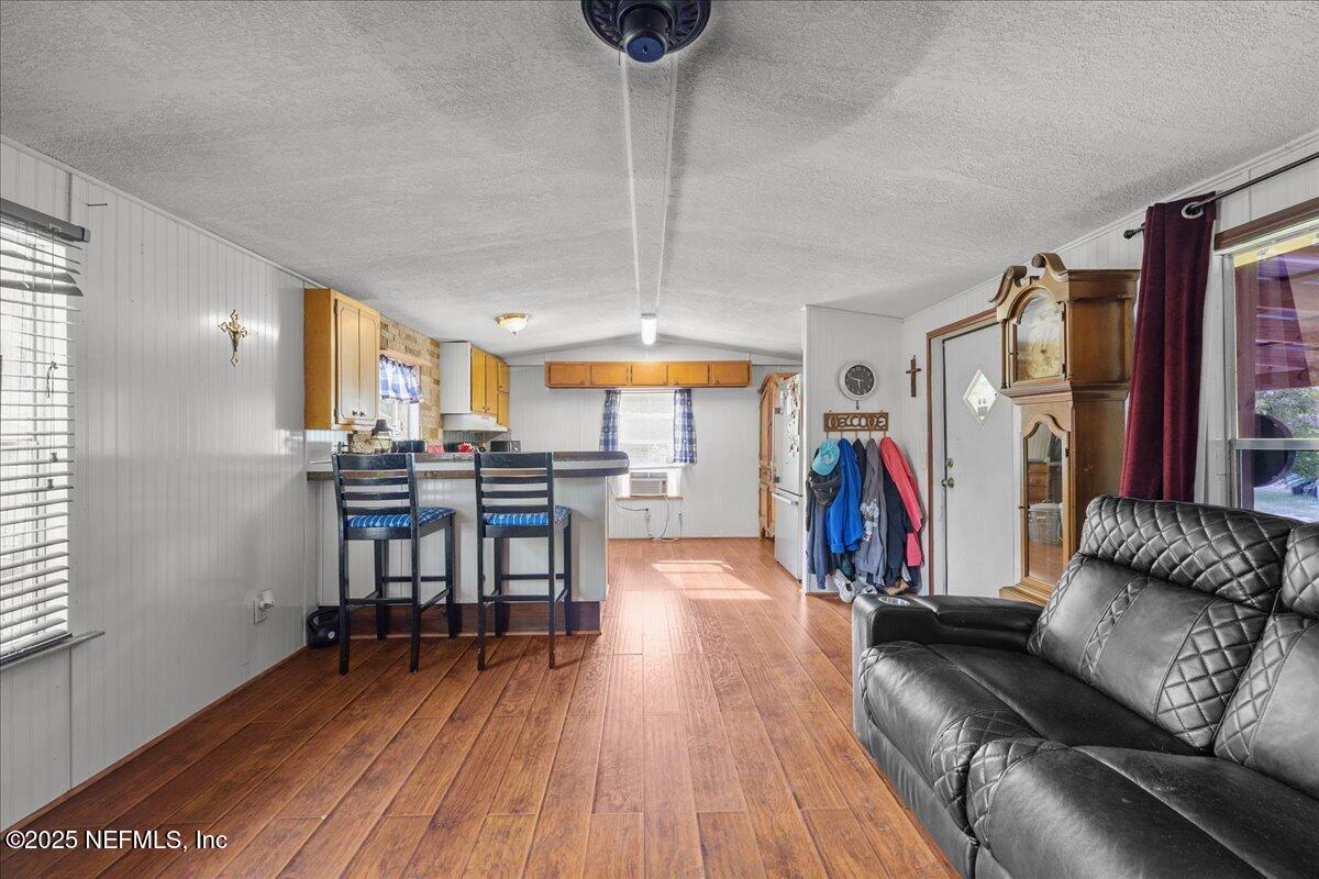 4961 Bent Twig Road Middleburg, FL 32068 - Photo 8 of 17 a view of a livingroom with furniture and a floor to ceiling window