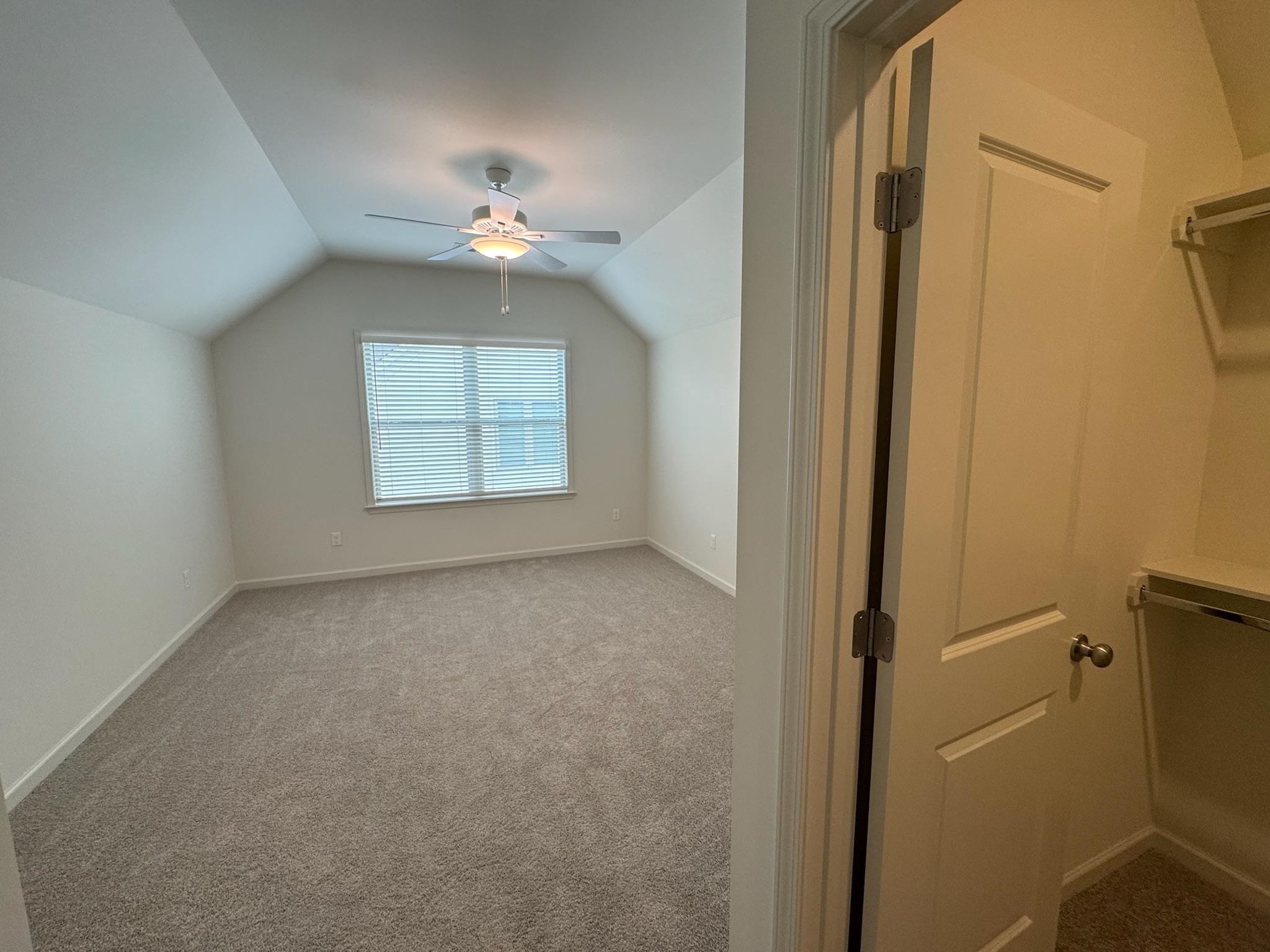 11512 Sunsparkler Way Collierville, TN 38017 - Photo 34 of 40 Additional living space featuring dark carpet and a ceiling fan