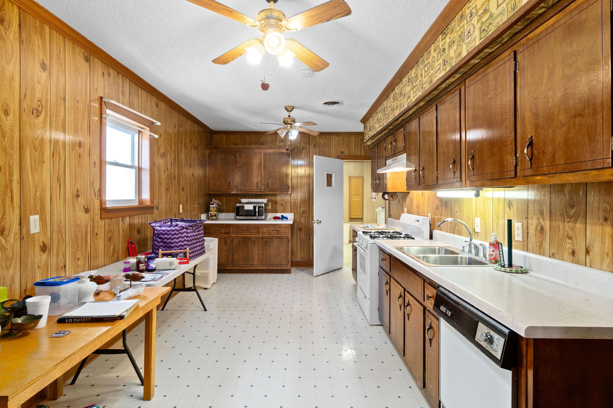 752 Highway 13 Cunningham, TN 37052 - Photo 18 of 32 a kitchen with stainless steel appliances kitchen island granite countertop a sink cabinets and window