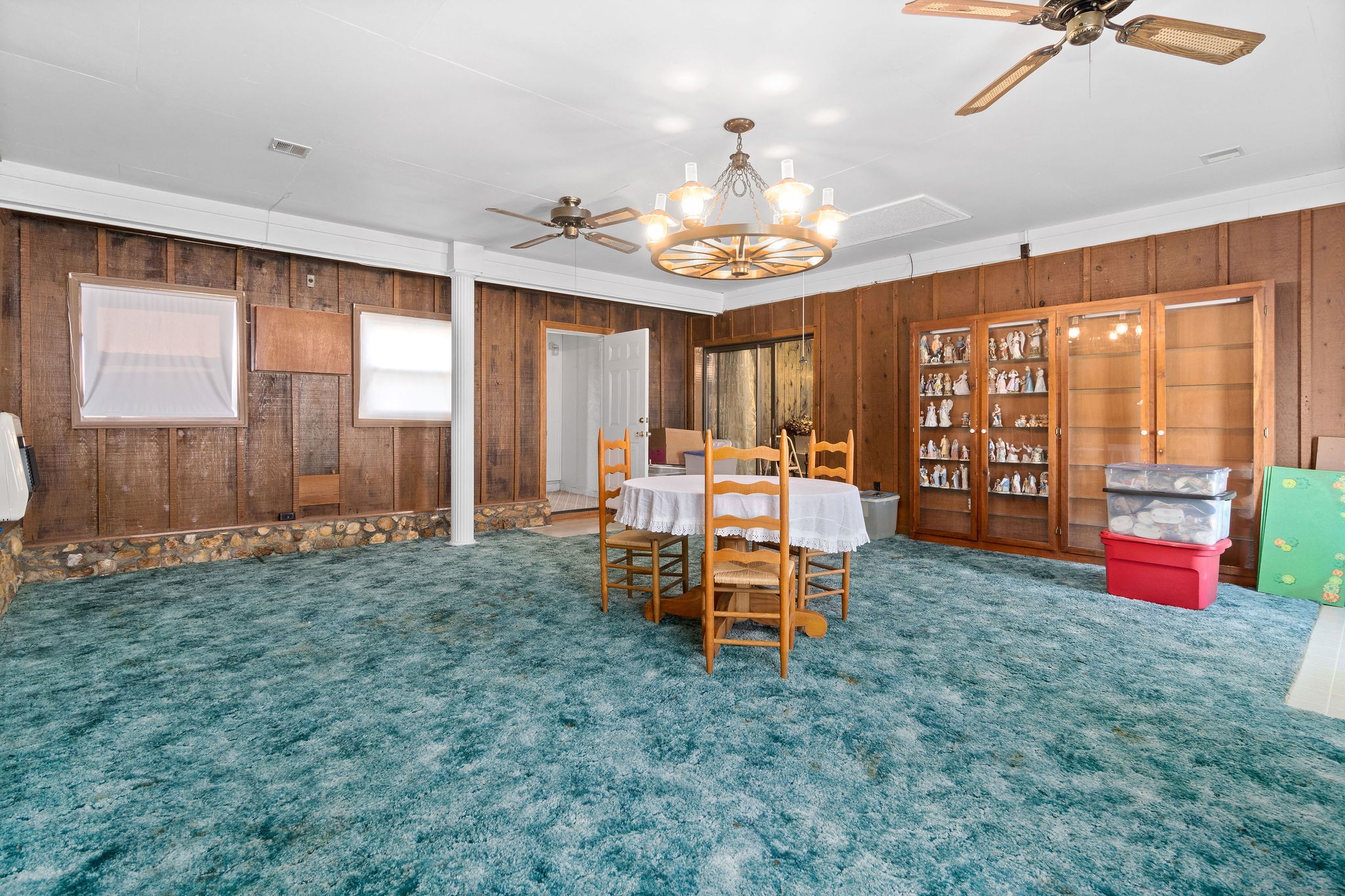 752 Highway 13 Cunningham, TN 37052 - Photo 22 of 32 a view of a dining room with furniture a chandelier and a large window