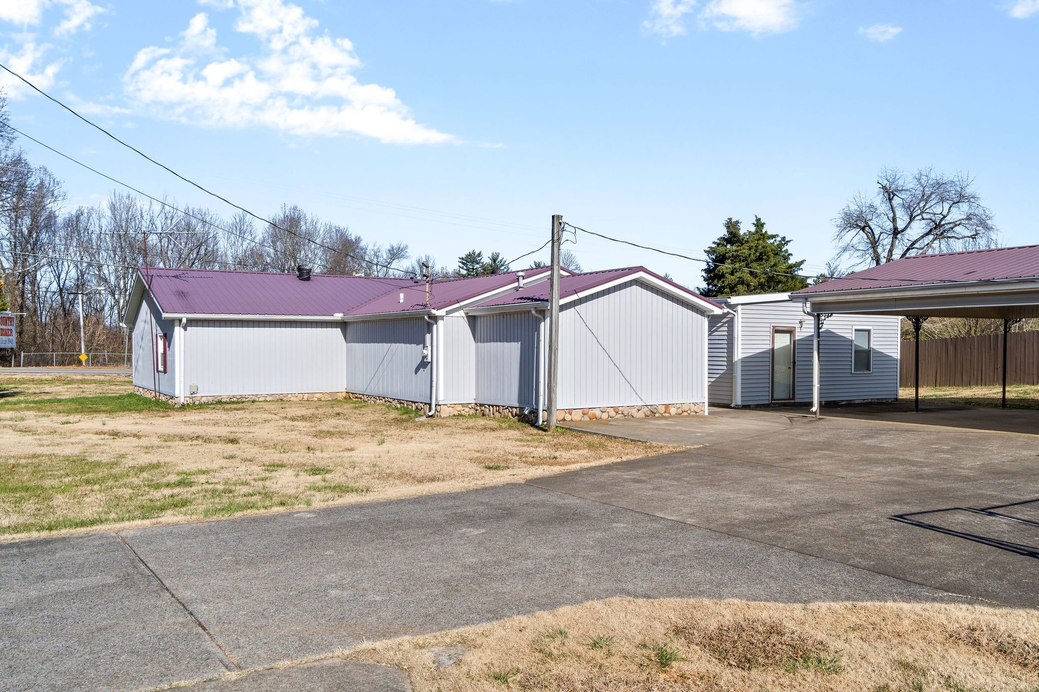 752 Highway 13 Cunningham, TN 37052 - Photo 25 of 32 a view of a house with a yard and garage