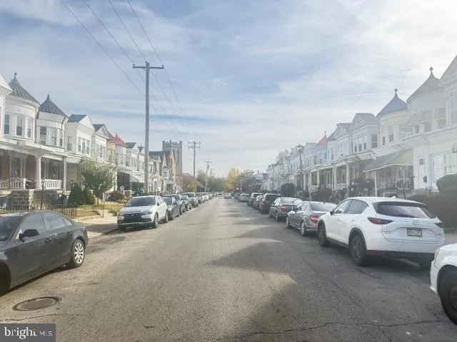 a view of cars parked in front of a building