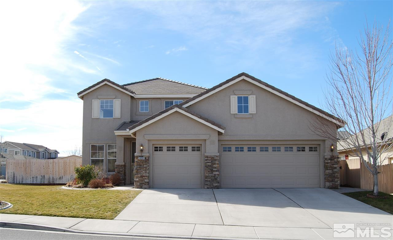10095 Kentfield Place Reno, NV 89521 - Photo 1 of 1 a front view of a house with a garden and yard