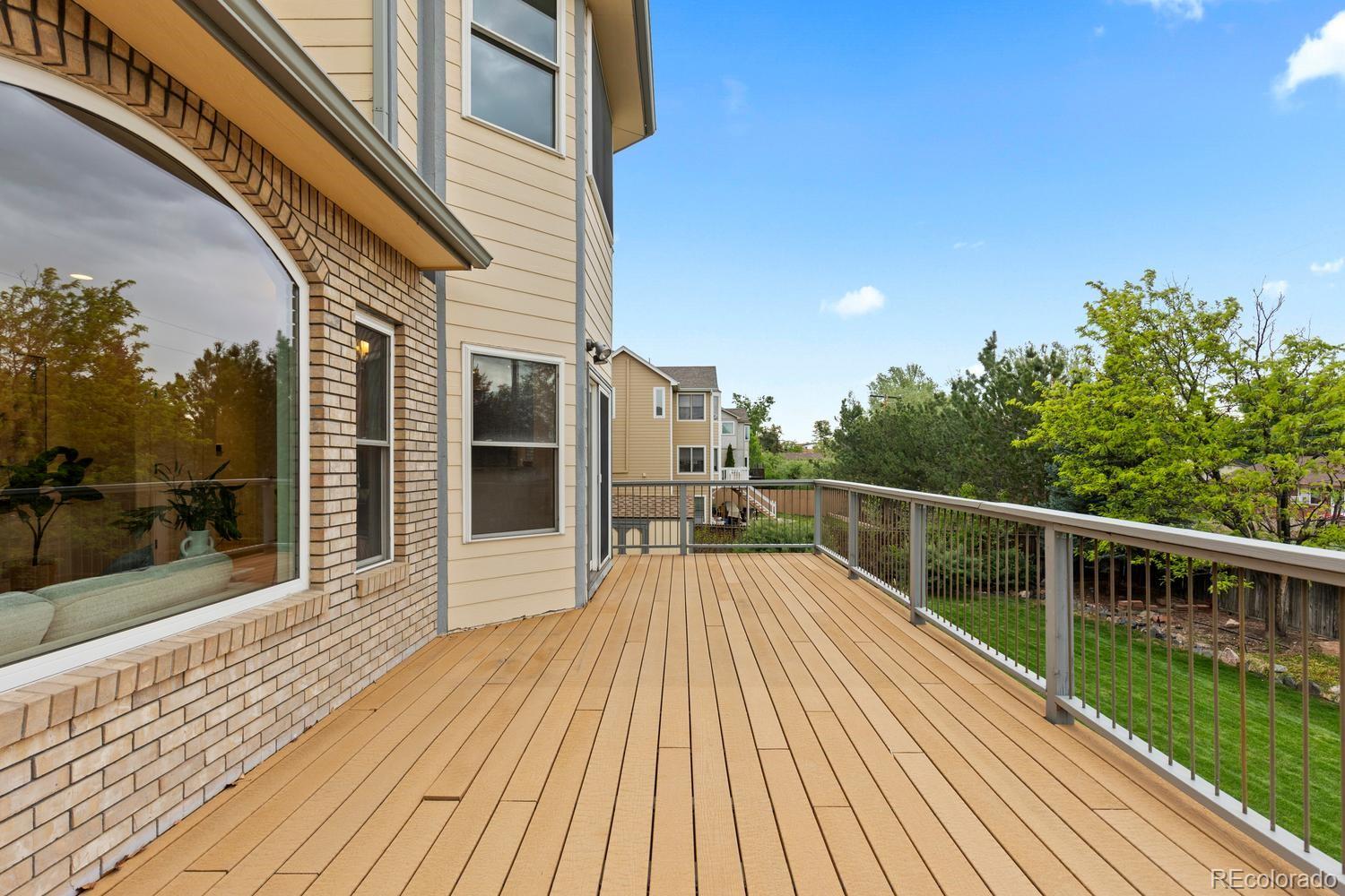3900 Pierson Street Wheat Ridge, CO 80033 - Photo 37 of 39 a view of balcony with deck and wooden floor