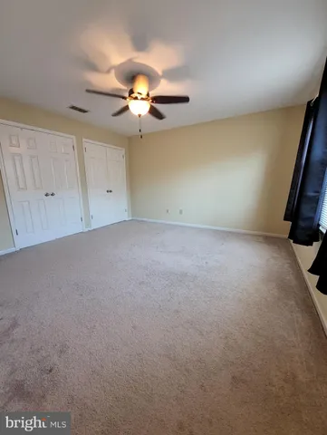 a view of a big room with carpet