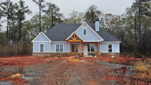 a front view of a house with yard