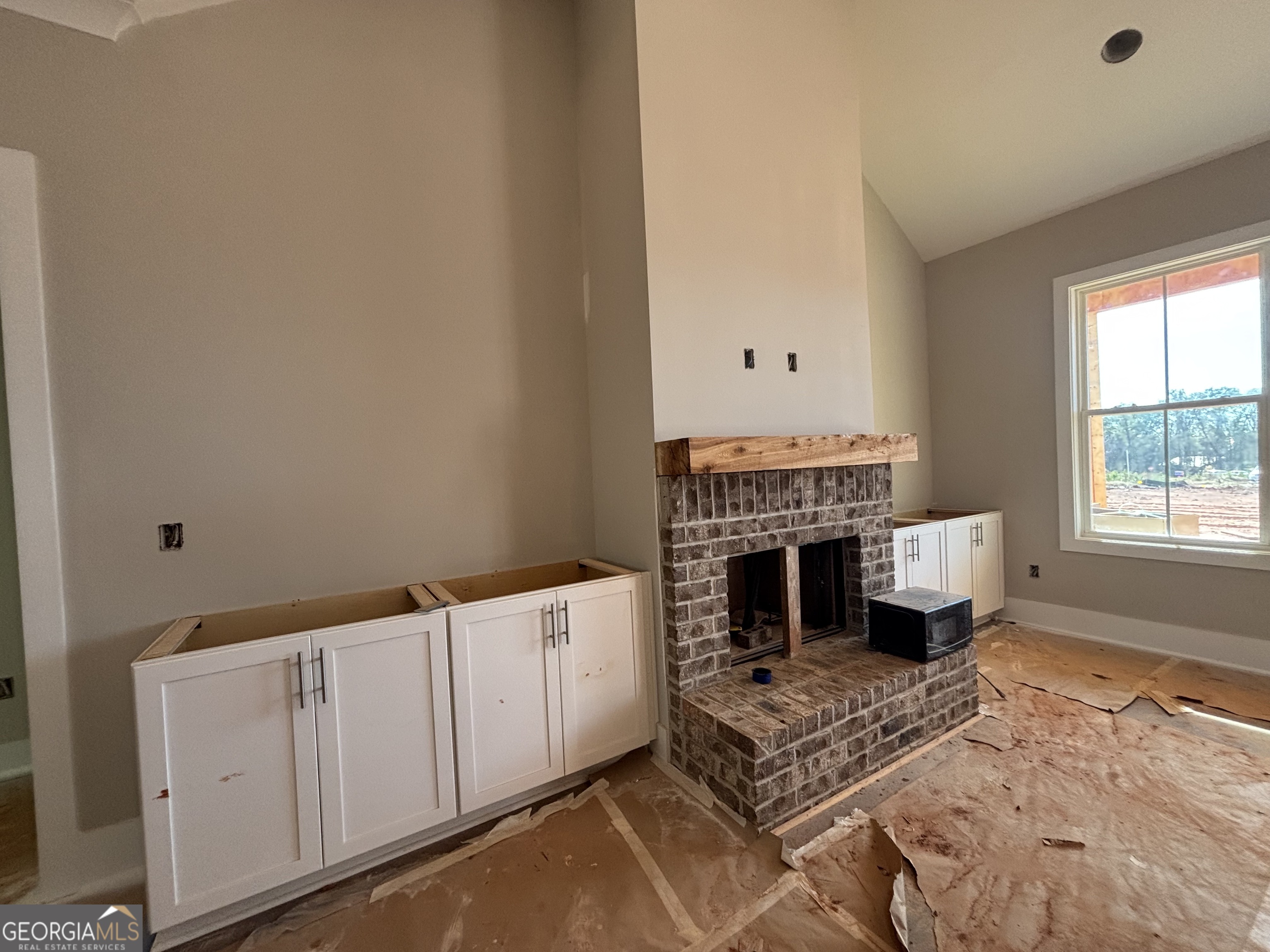 125 Hawthorne Lane Forsyth, GA 31029 - Photo 11 of 19 a living room with furniture fireplace and window