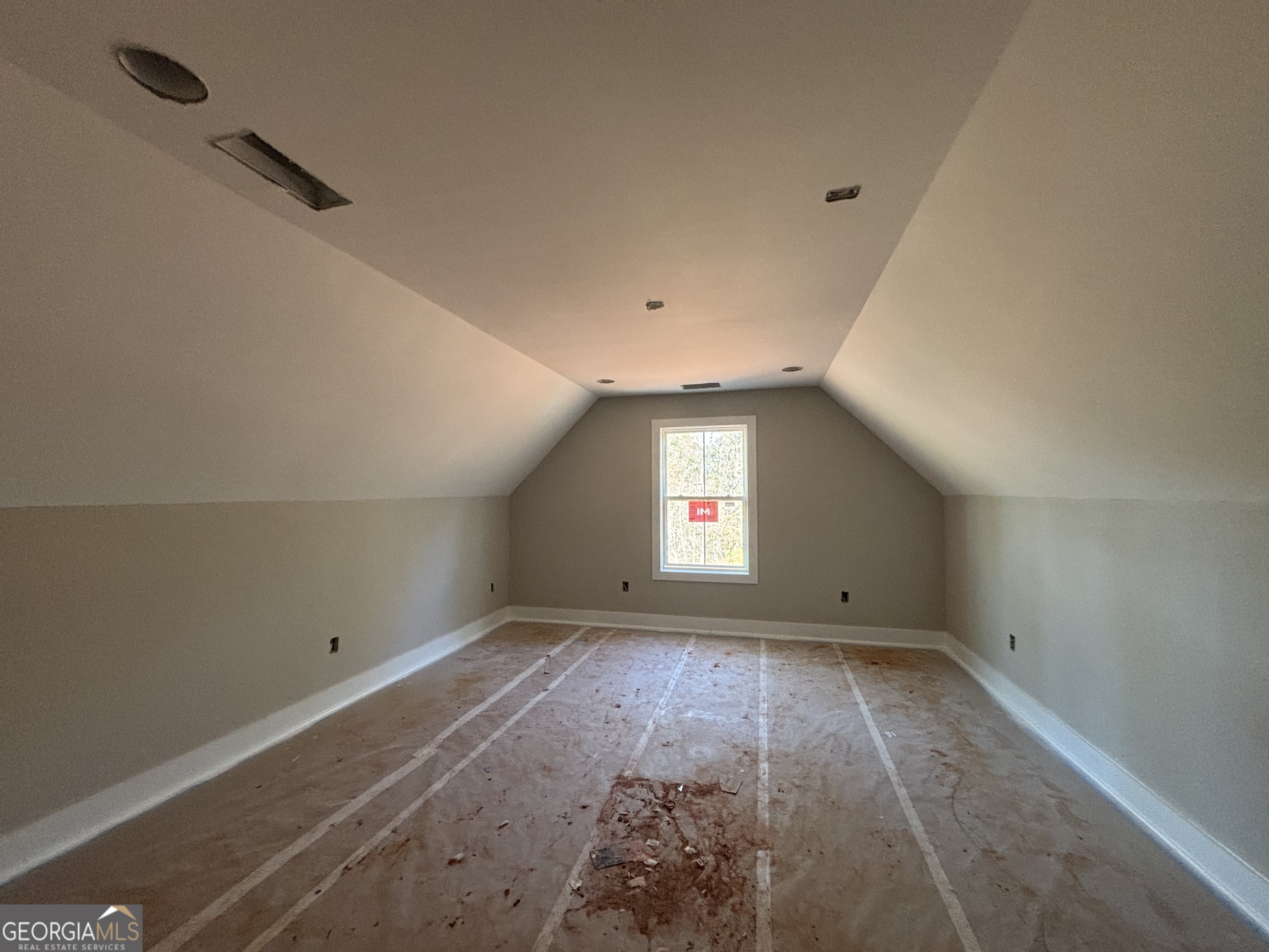 125 Hawthorne Lane Forsyth, GA 31029 - Photo 18 of 19 a view of an empty room with a window